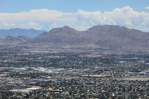 buildings and mountains during daytime