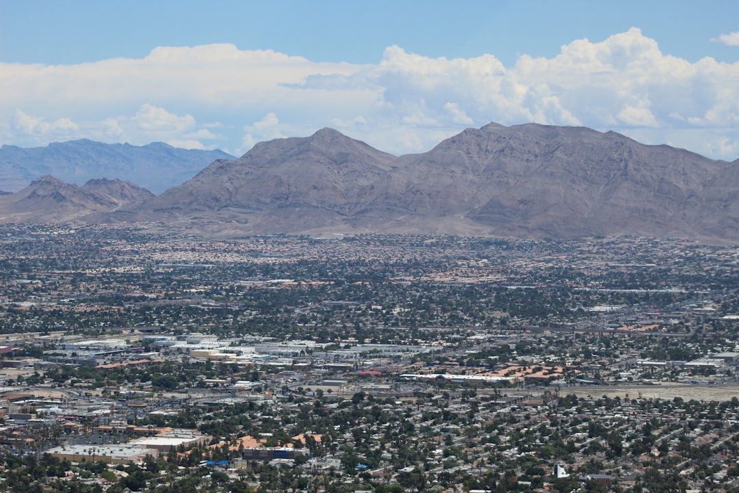 buildings and mountains during daytime,