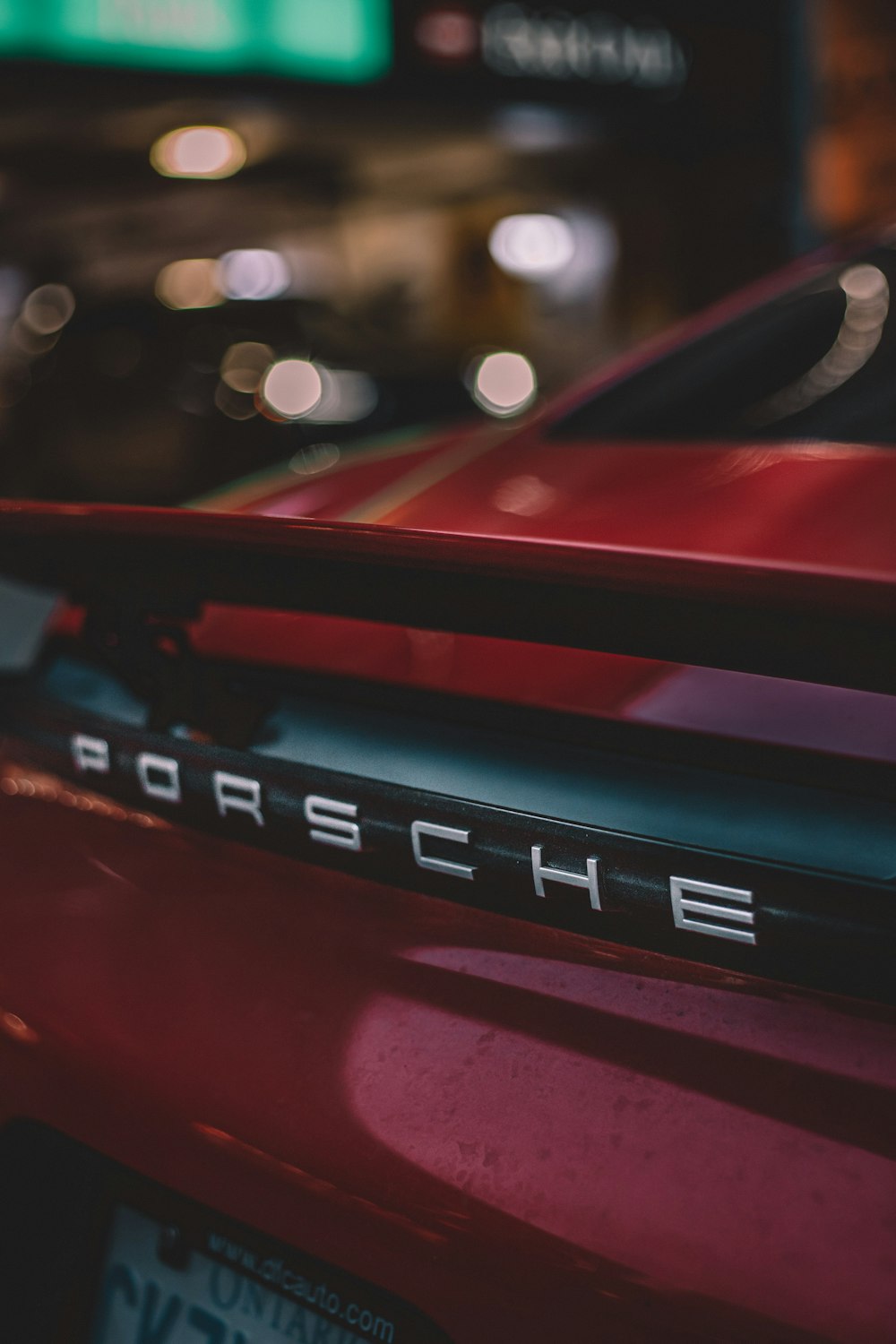 parked red Porsche