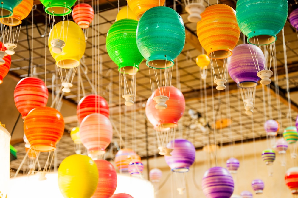 multicolored ceramic jars hanging on ceiling