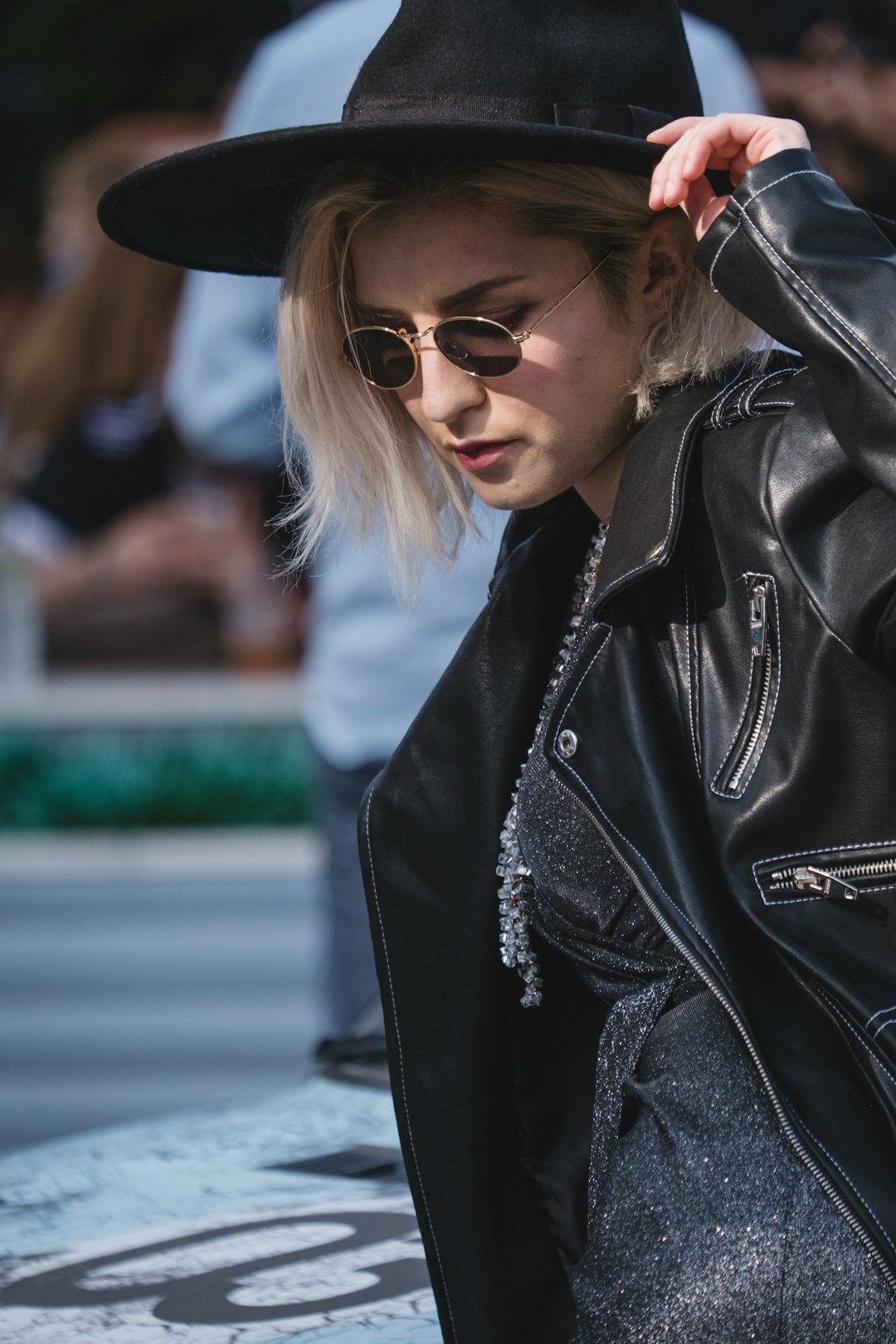 woman wearing black leather zip-up jacket