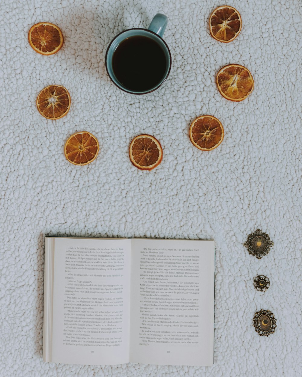 book near the blue mug