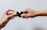 two person holding papercut heart