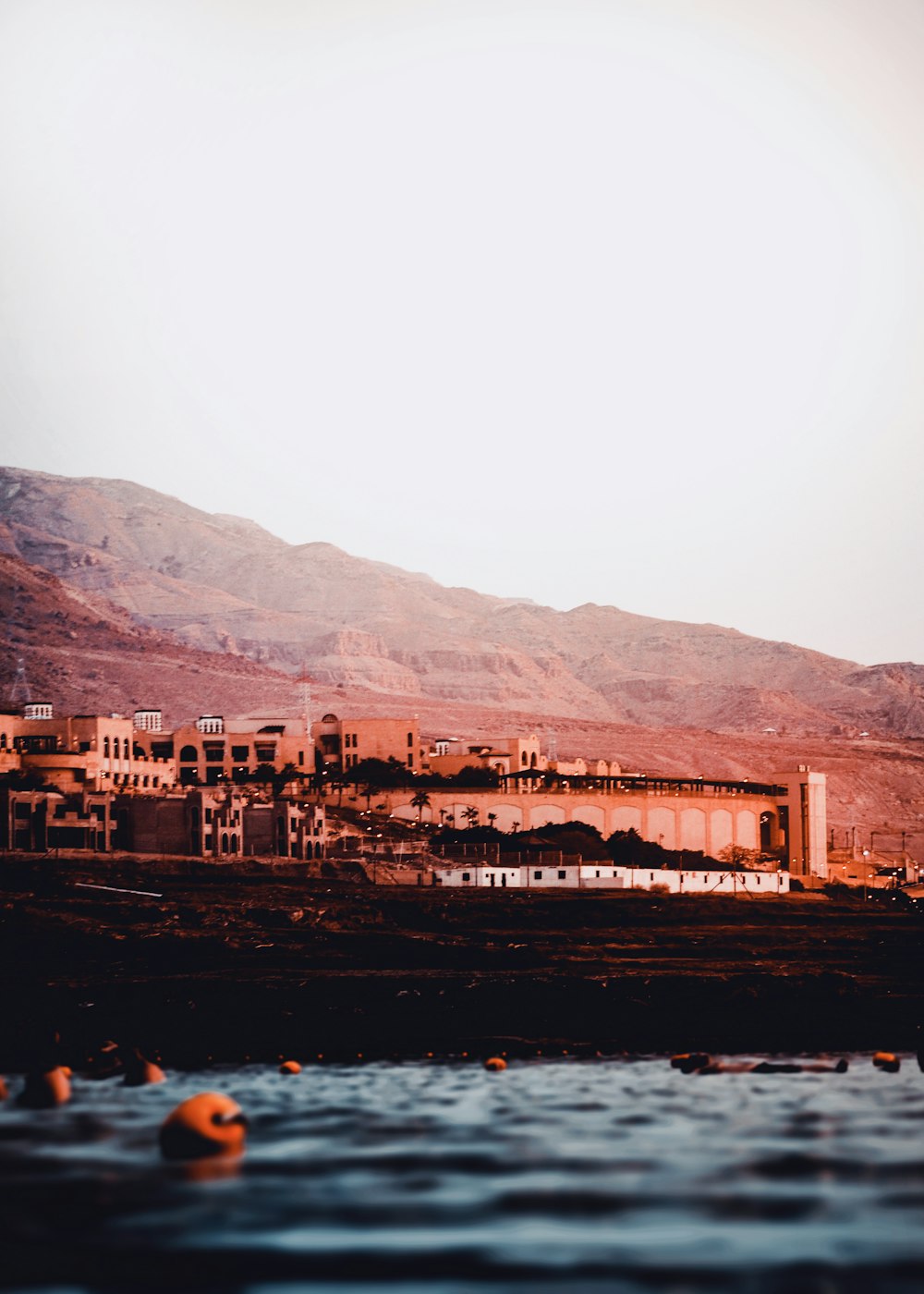 body of water near concrete building during daytime