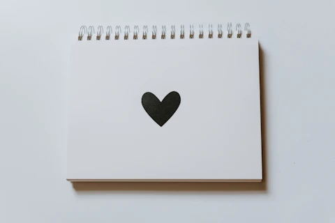 black heart drawn on notebook