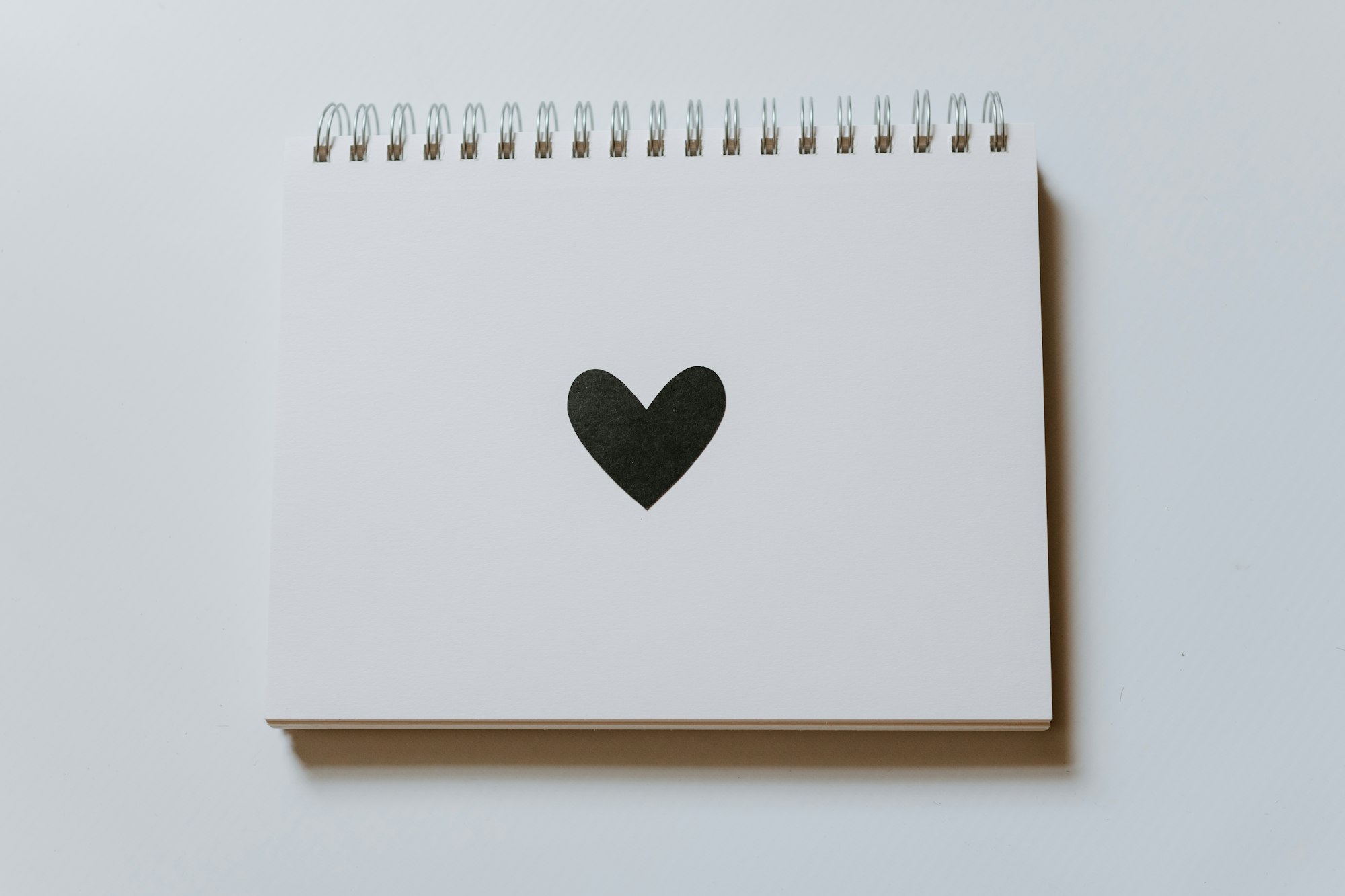 black heart on a blank notebook