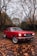 selective focus photography of parked red Ford Mustang coupe
