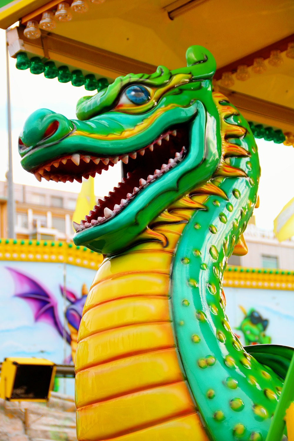 green and yellow dragon statue during daytime