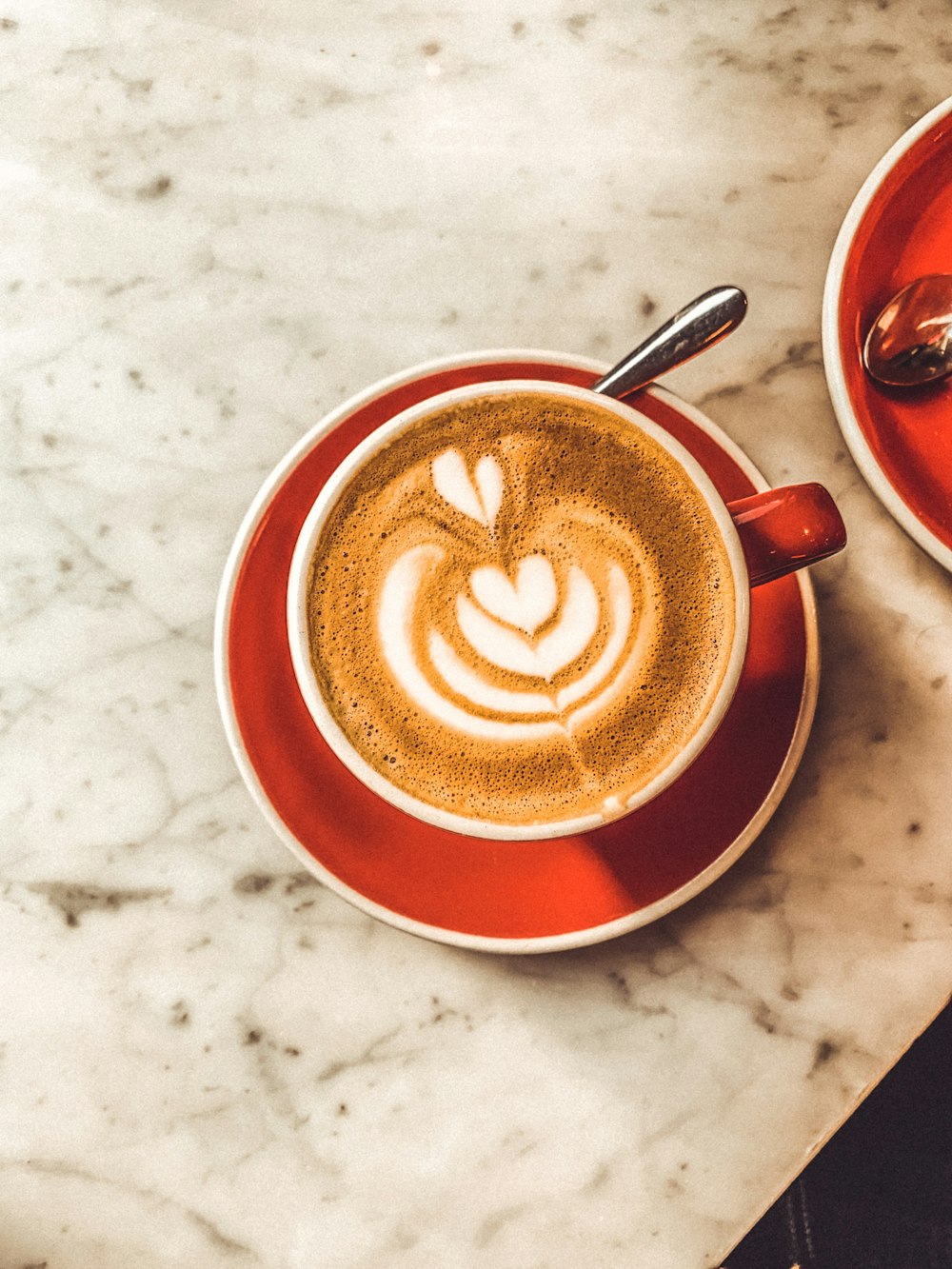 red ceramic teacup