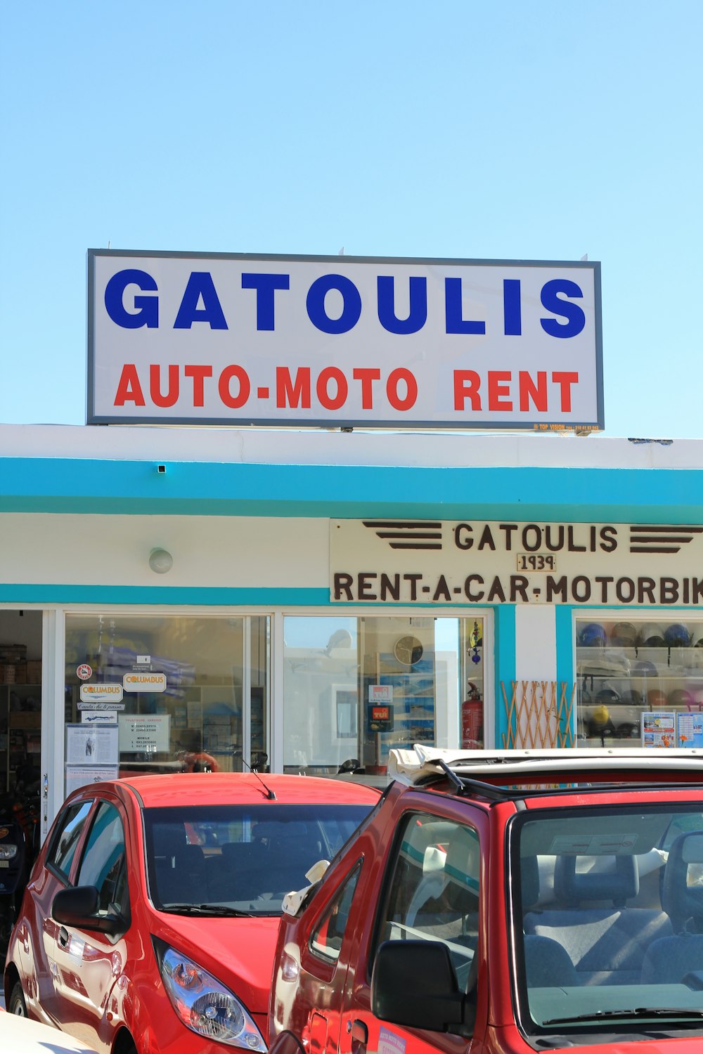 Gatoulis auto moto rent signage