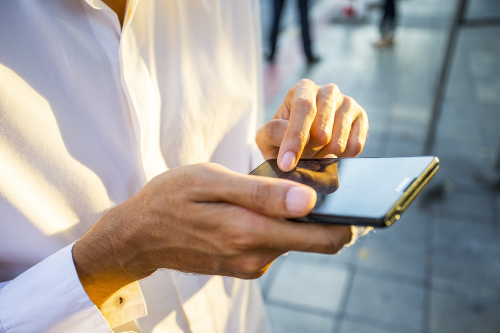 person using black Android smartphone