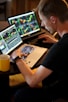 man sitting in front of the laptop