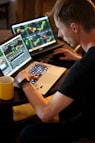 man sitting in front of the laptop