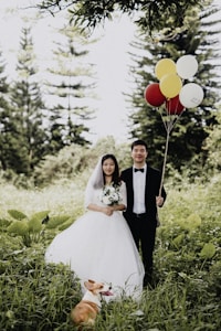 newly wed couple walking on the grass field