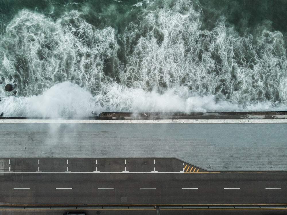 sea waves crashing on the street