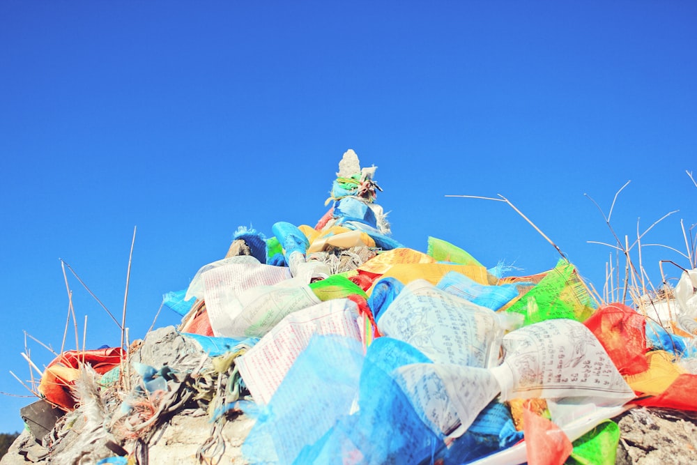 a pile of garbage with a statue on top of it