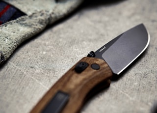 brown and black pocketknife