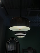 A modern living room illuminated by stylish pendant lights.