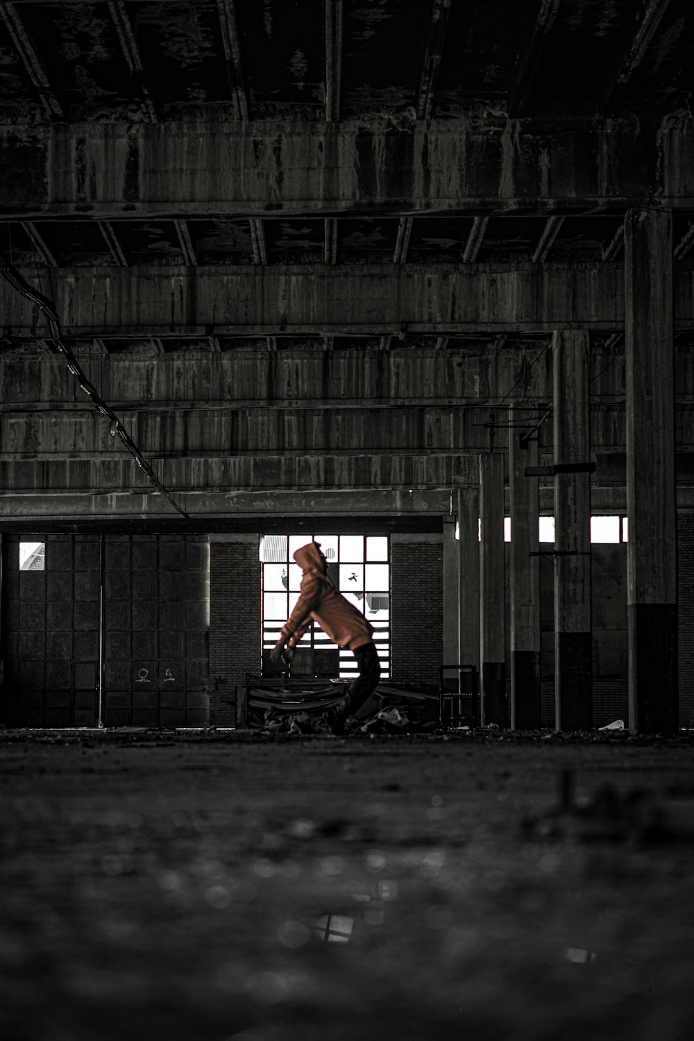 a man sitting on a bench in a building