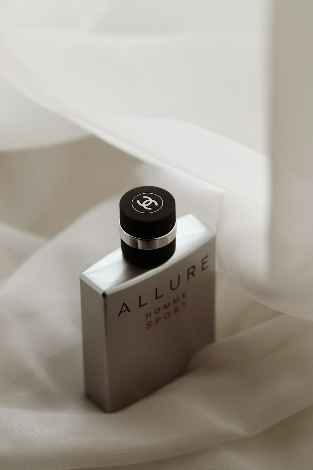 selective focus photography of Allure Homme fragrance bottle