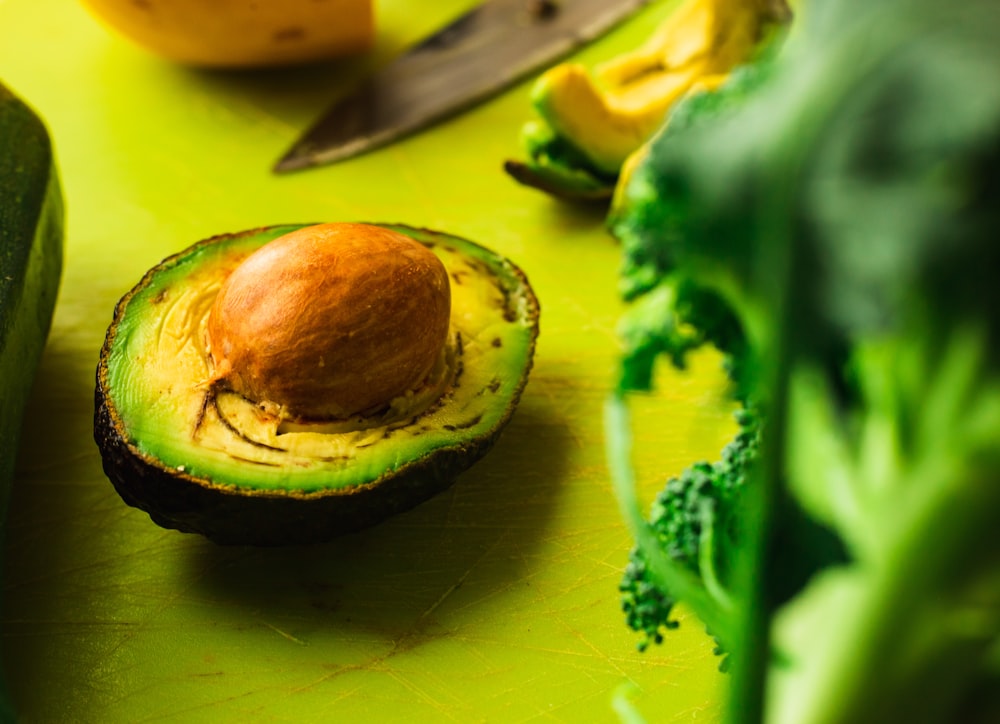 avocado on green surface