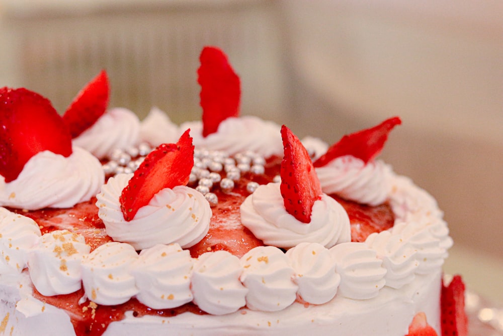 selective focus photography of white and red icing-covered cake