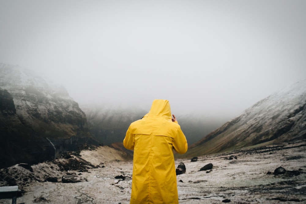 person in yellow coat