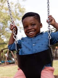 boy riding swing