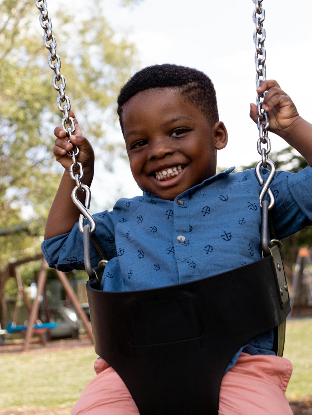 boy riding swing