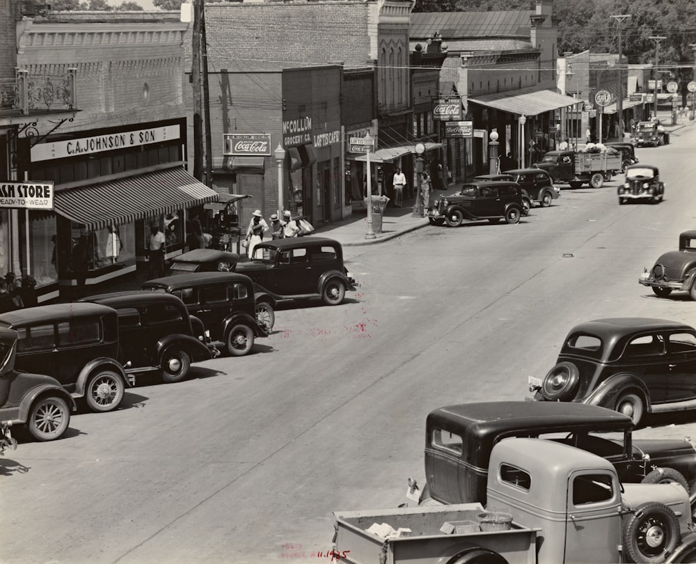 grayscale photography of vehicle parked on street