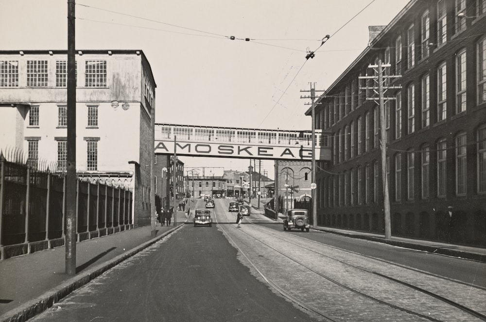 vehicles crossing between industrial buildings