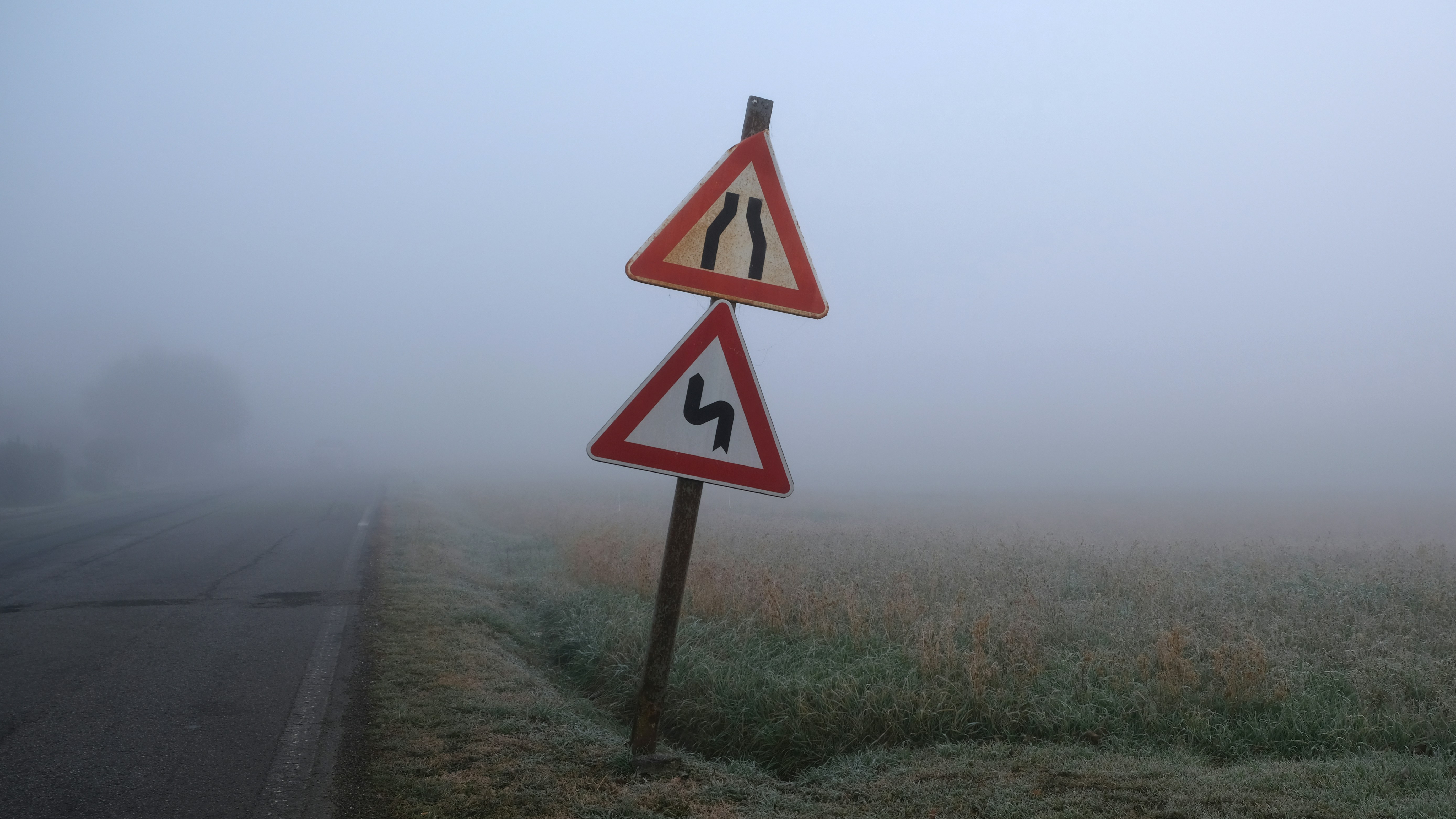 road signs covered with mist