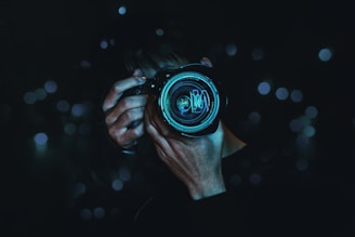 person holding black camera
