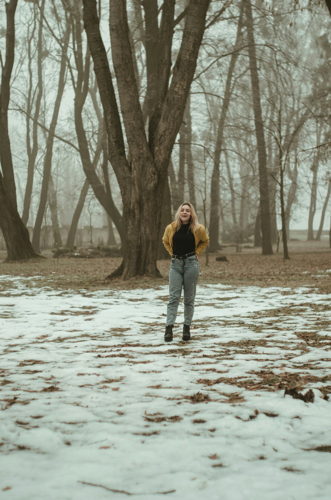 selective focus photography of woman standing near outdoor during daytime