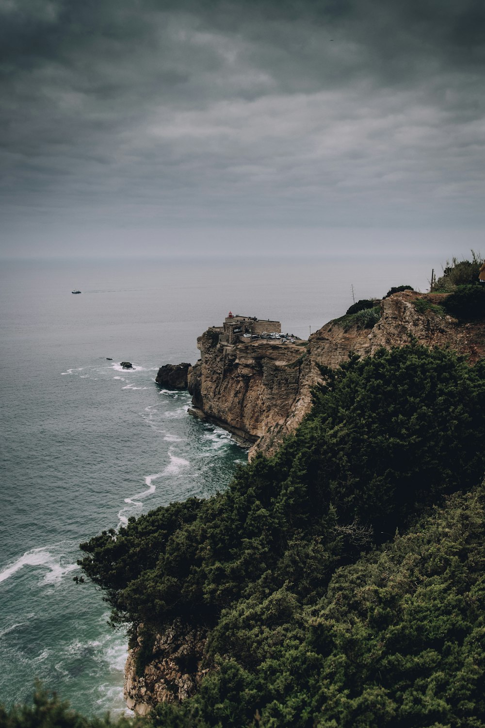 a view of the ocean from the top of a hill