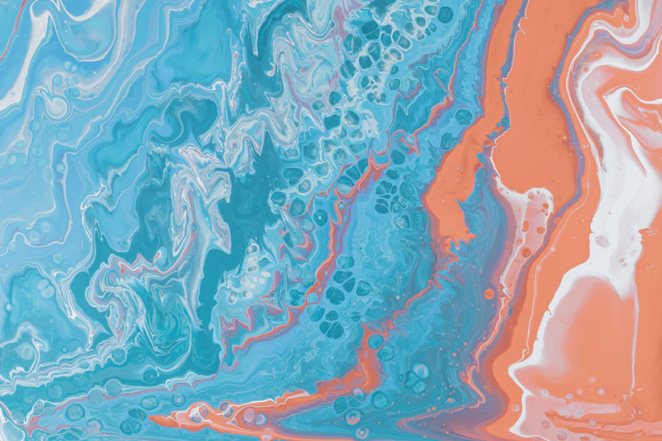 The image presents a vibrant abstract painting that captures the essence of ocean waves. The artwork is predominantly blue and orange, with splashes of white and black adding depth to the piece. The brushstrokes are loose and fluid, creating an impressionistic style reminiscent of impressionist art. The colors used in this painting are bold and striking, making it a visually captivating piece that invites viewers to explore its intricate details.