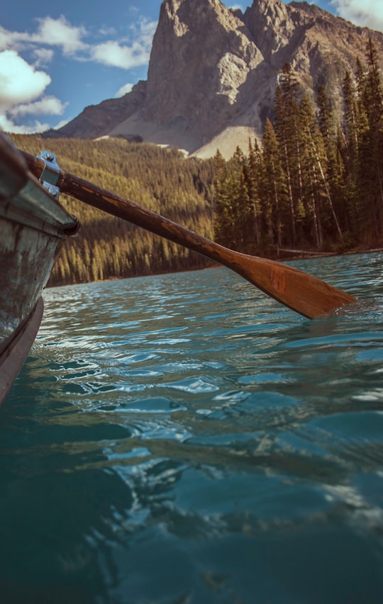 brown boat on body of water during daytime in Emerald Lake Canada