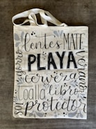Hand-painted canvas tote bag featuring punk rock slogans and edgy designs.