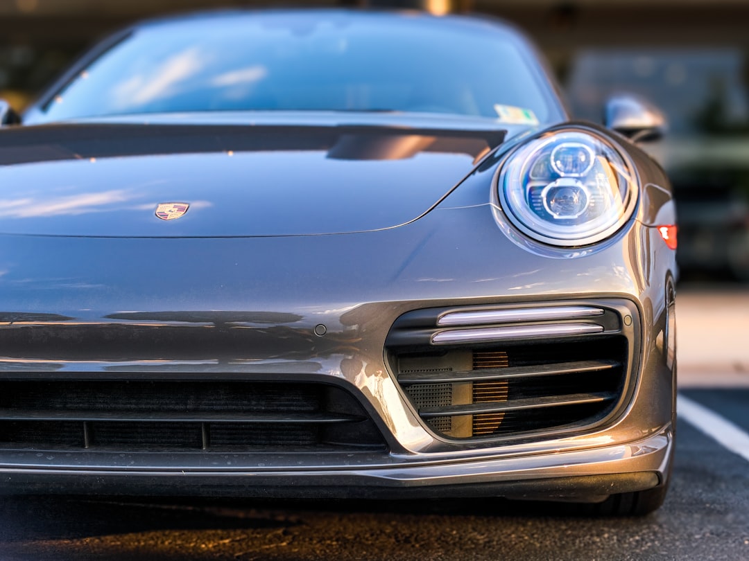 silver Cadillac coupe, Porsche Cayman in Tyson