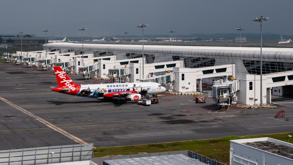 red and white Air Asia airliner