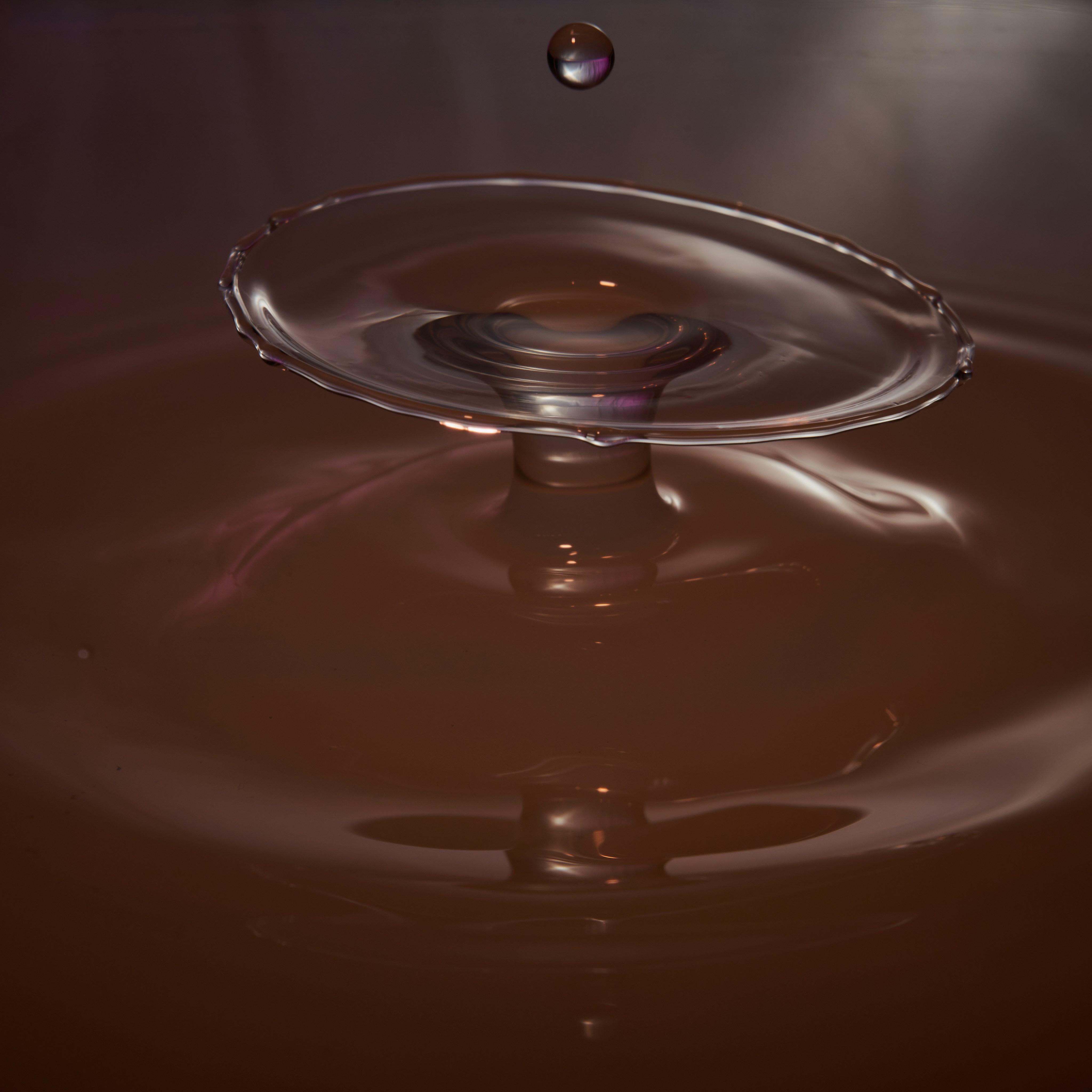 Water drop collisions.<br />Xantam gum, 3 flashes, color gels.