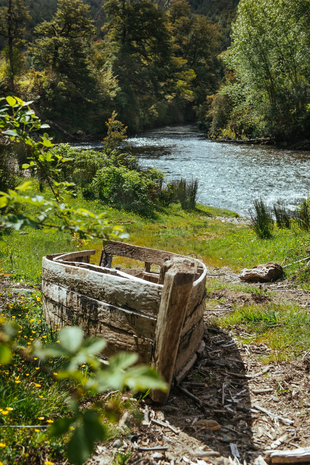 gray wooden boat on shore