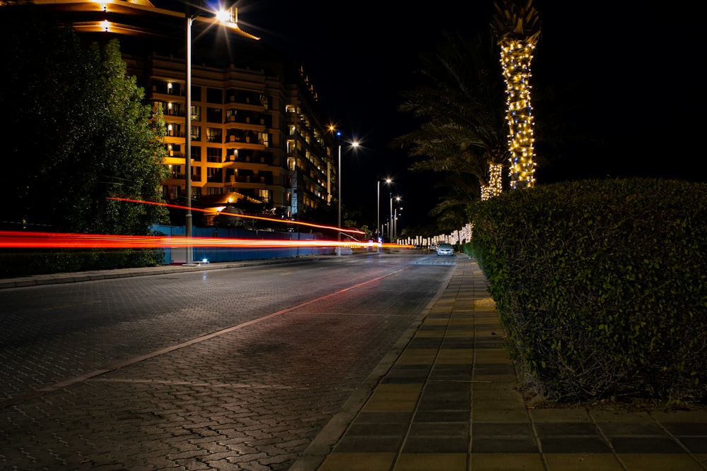 time-lapse photography of vehicle on road at night