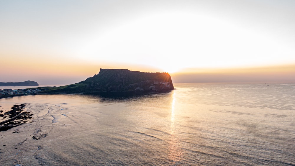 gray sea cliff during golden hour