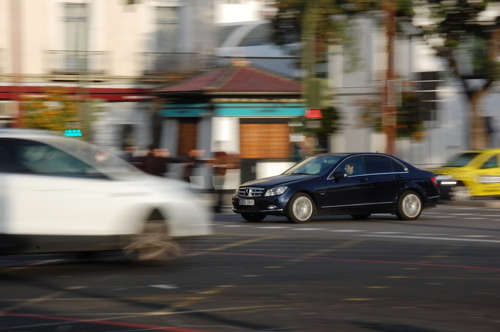 vehicles passing on road during daytime