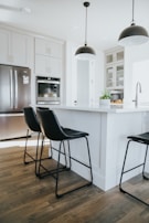 A modern pendant light hanging over a kitchen island.