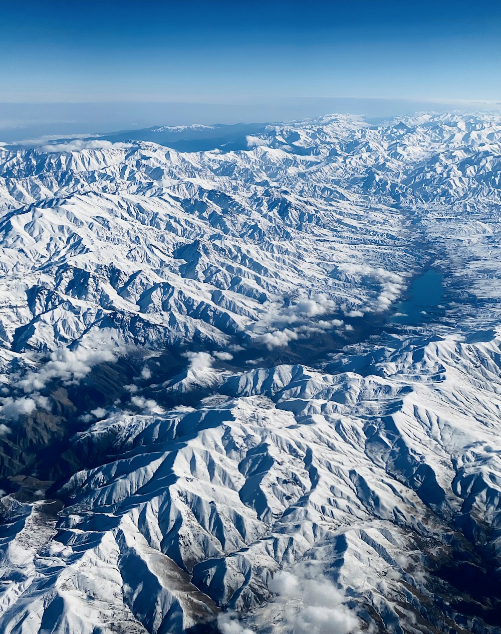 snow covered mountain during daytime