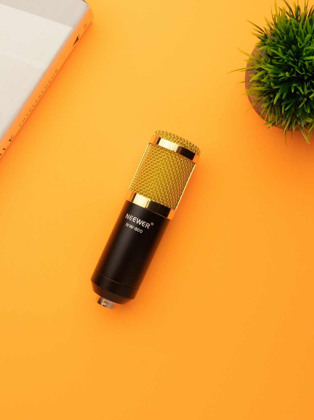 black and silver microphone on orange table