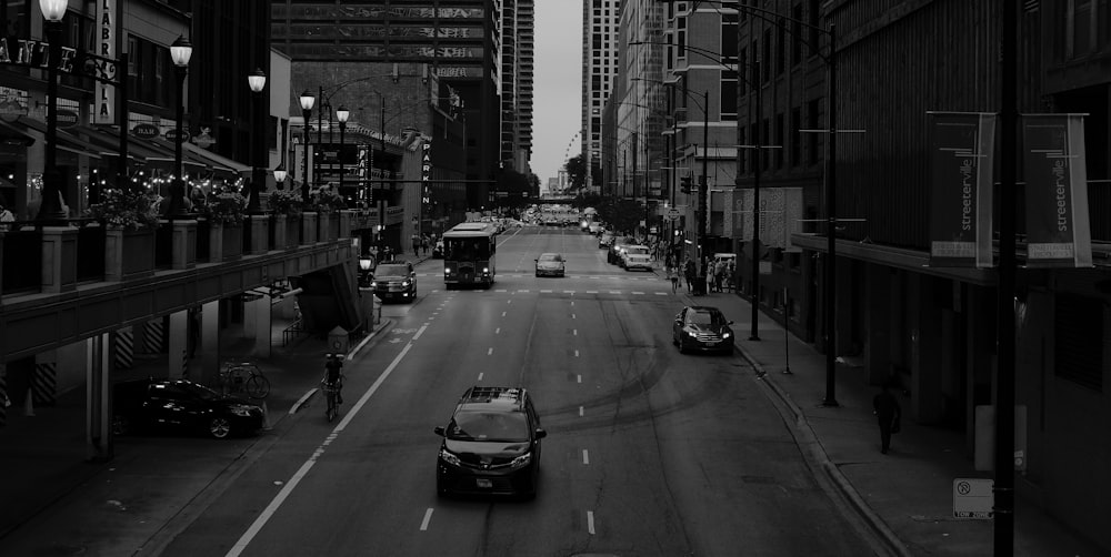 grayscale photo of cars on road