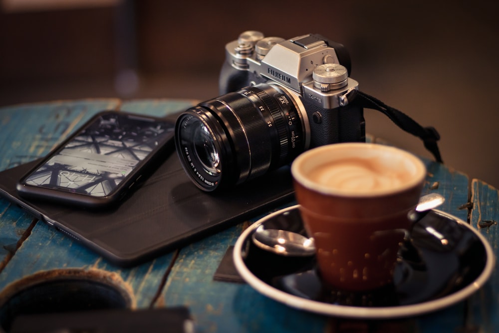 black and gray camera on table